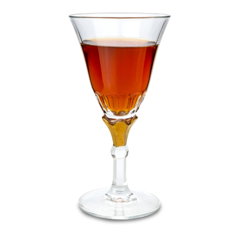 A crystal wine glass full of marsala wine