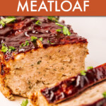 A chicken meatloaf cut into slices on a serving tray