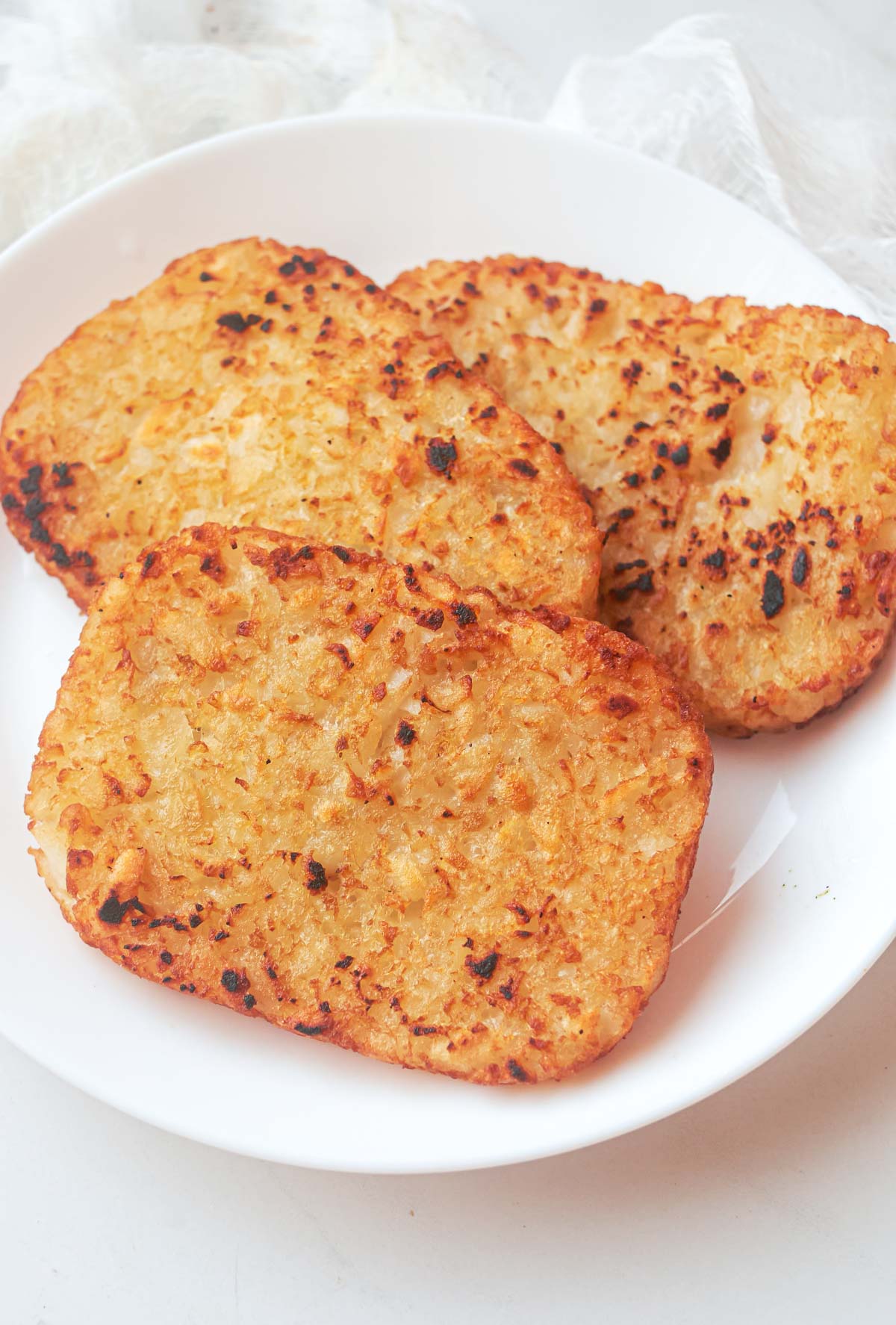 close up view of the cooked frozen hash browns on a plate