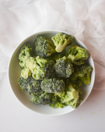 a bowl of frozen broccoli to use to learn how to cook frozen broccoli