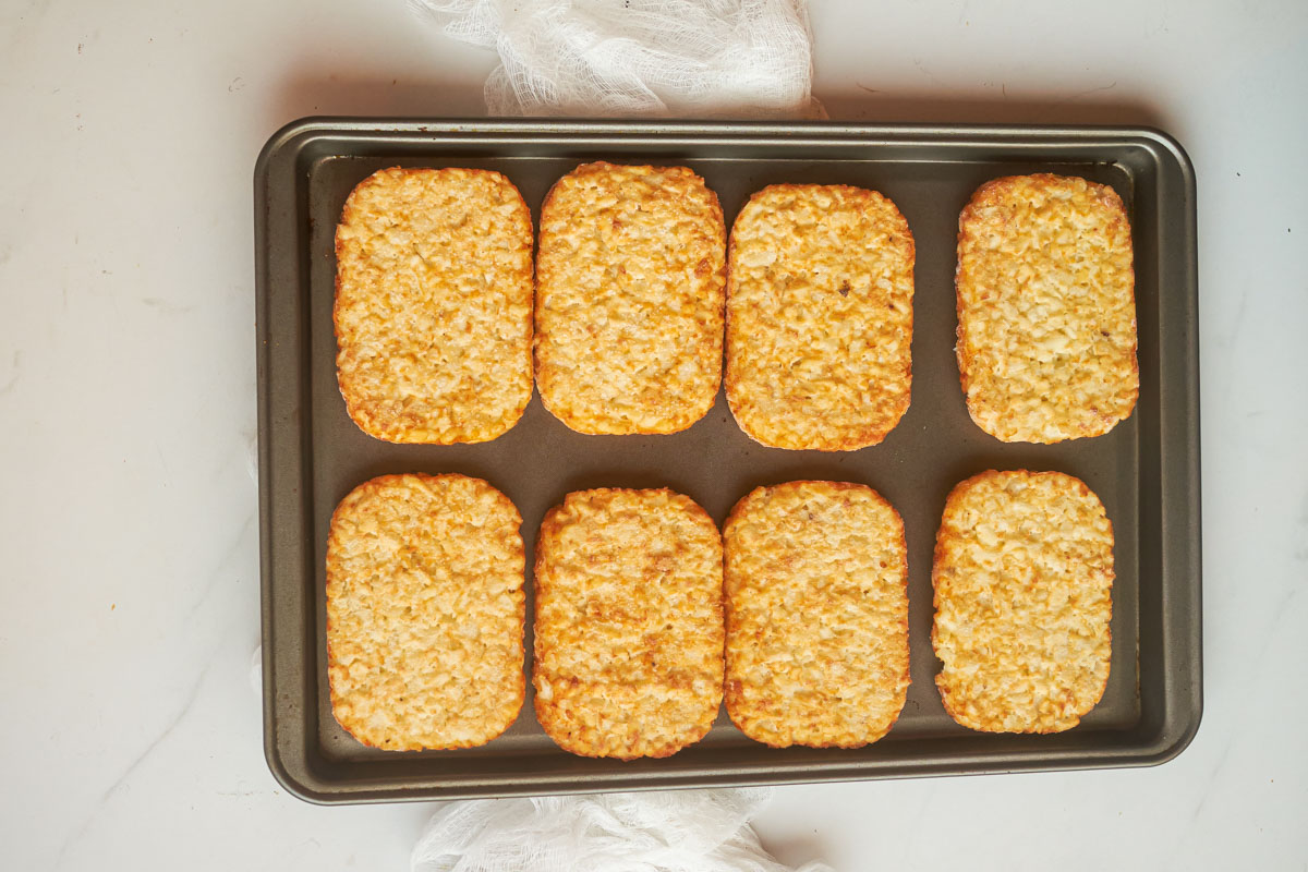 top down view of frozen hash browns on a baking tray