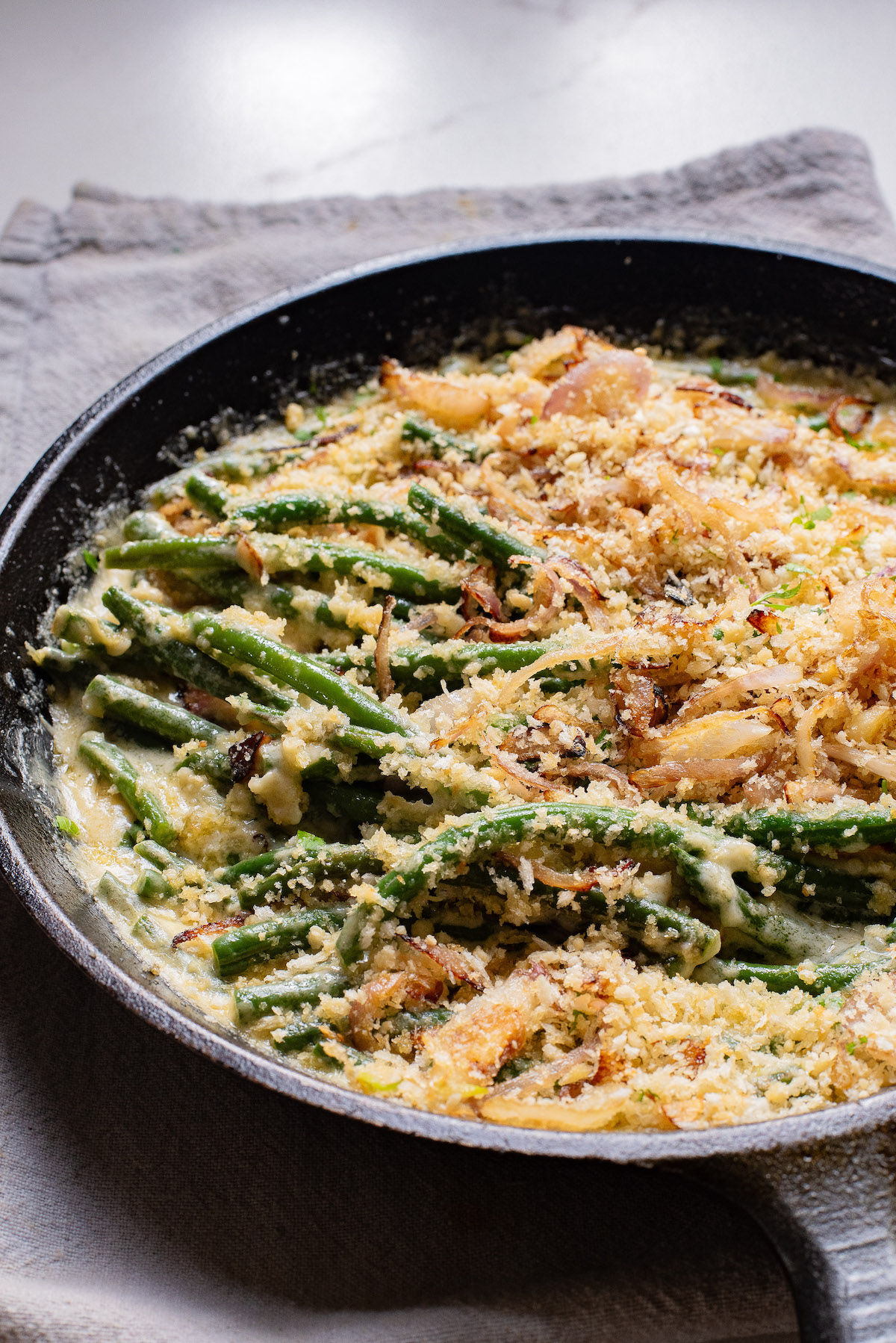the finished green bean casserole recipe in a skillet