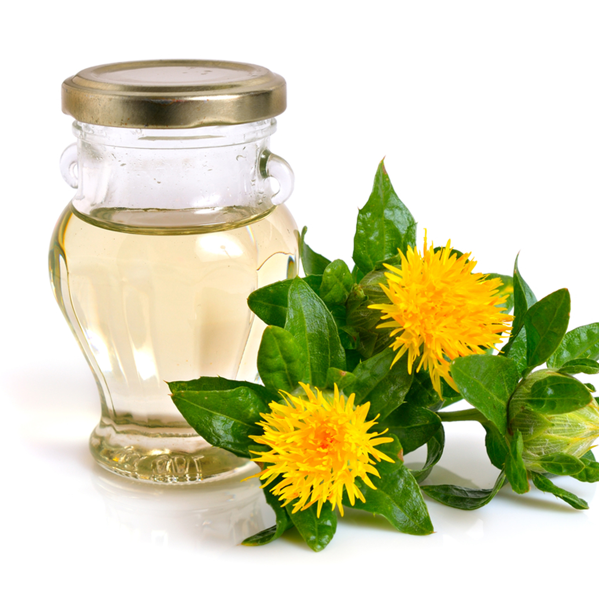 A jar of safflower oil with a sprig of safflowers beside it.