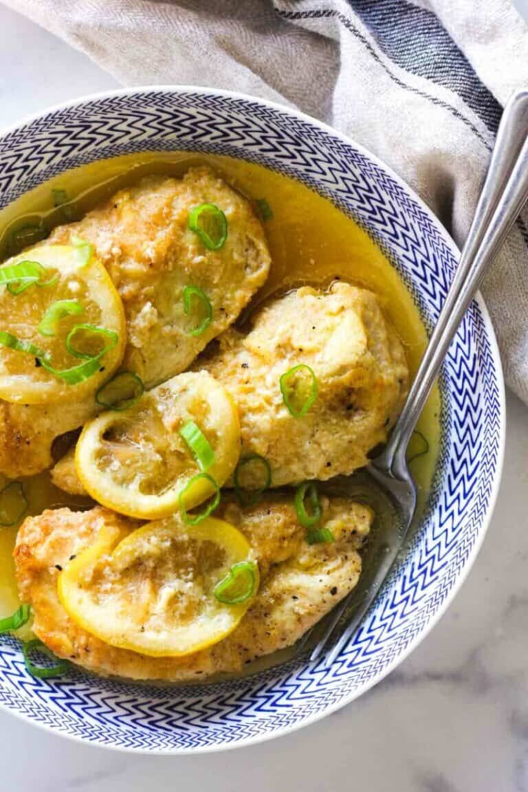 Crockpot Chicken Francese in a bowl with a spoon.
