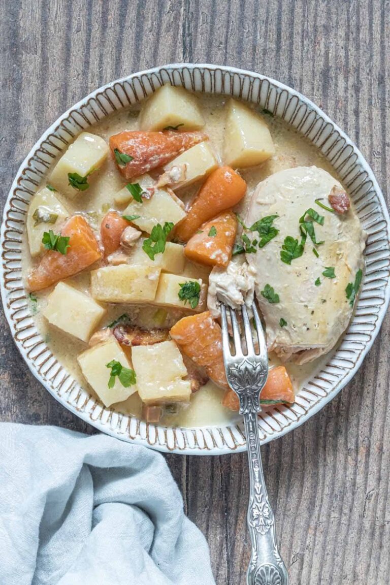 Crockpot Ranch Chicken Casserole in a plate with white and brown deco. 