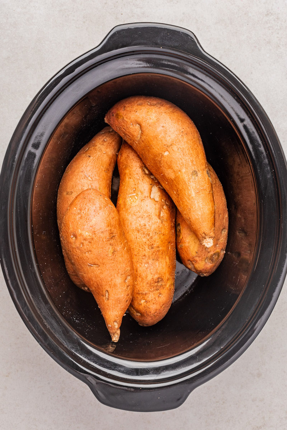 the sweet potatoes inside the slow cooker insert