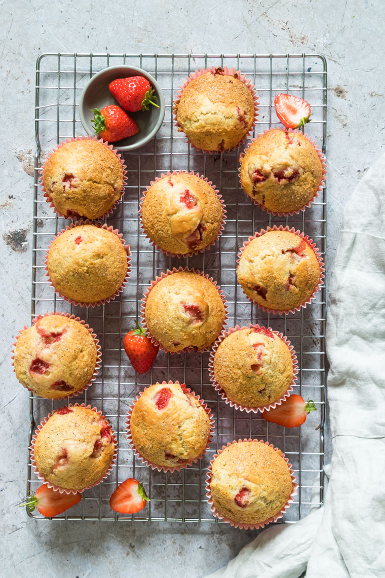 top down view of strawberry muffins on a baking rack