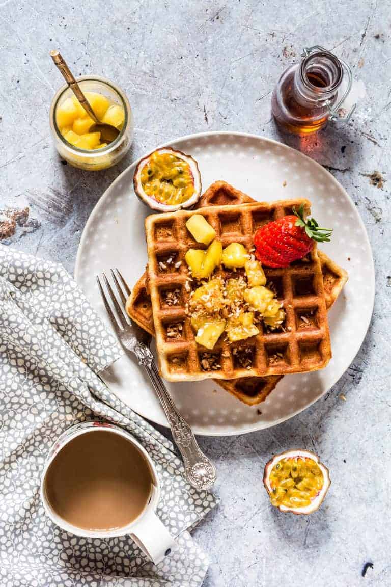 the completed buckwheat waffles recipe served with toppings and coffee