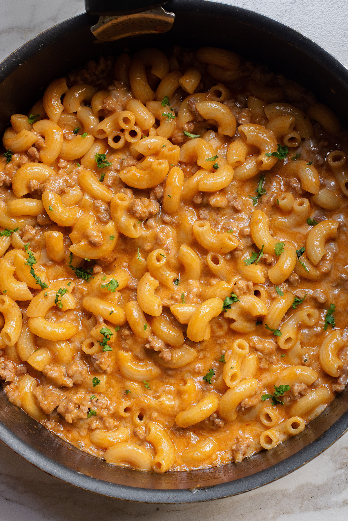 close up view of the completed hamburger helper in the skillet