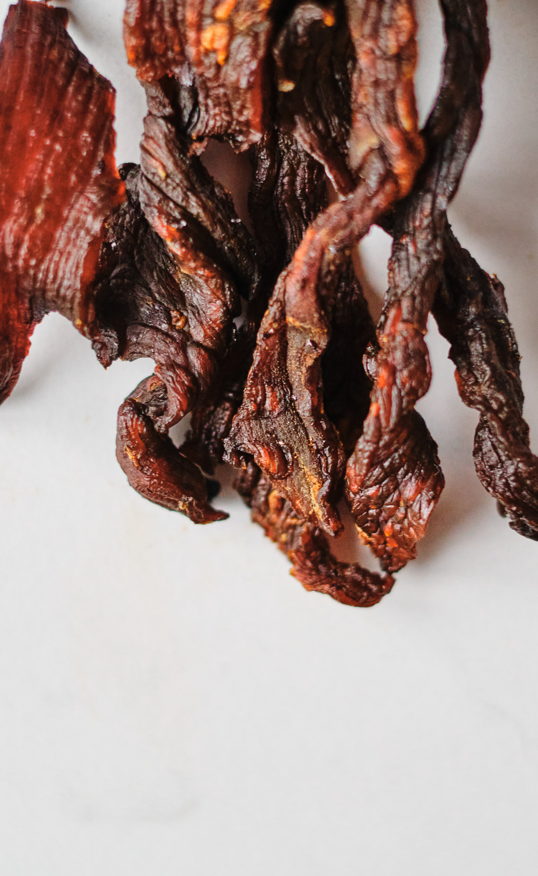 A view of Air Fryer Beef Jerky on a white plate.