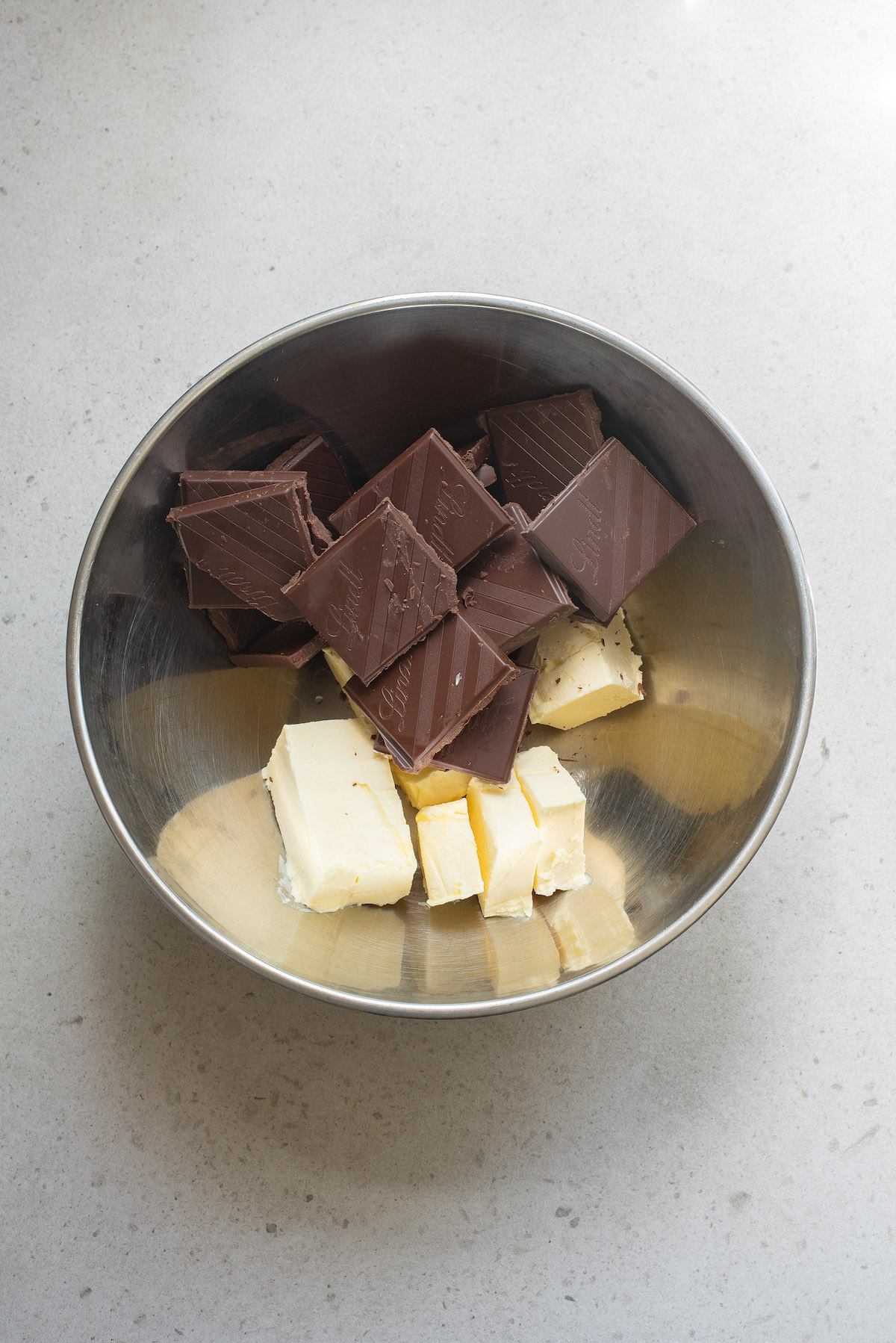 combining butter and chocolate is the first step for making this recipe