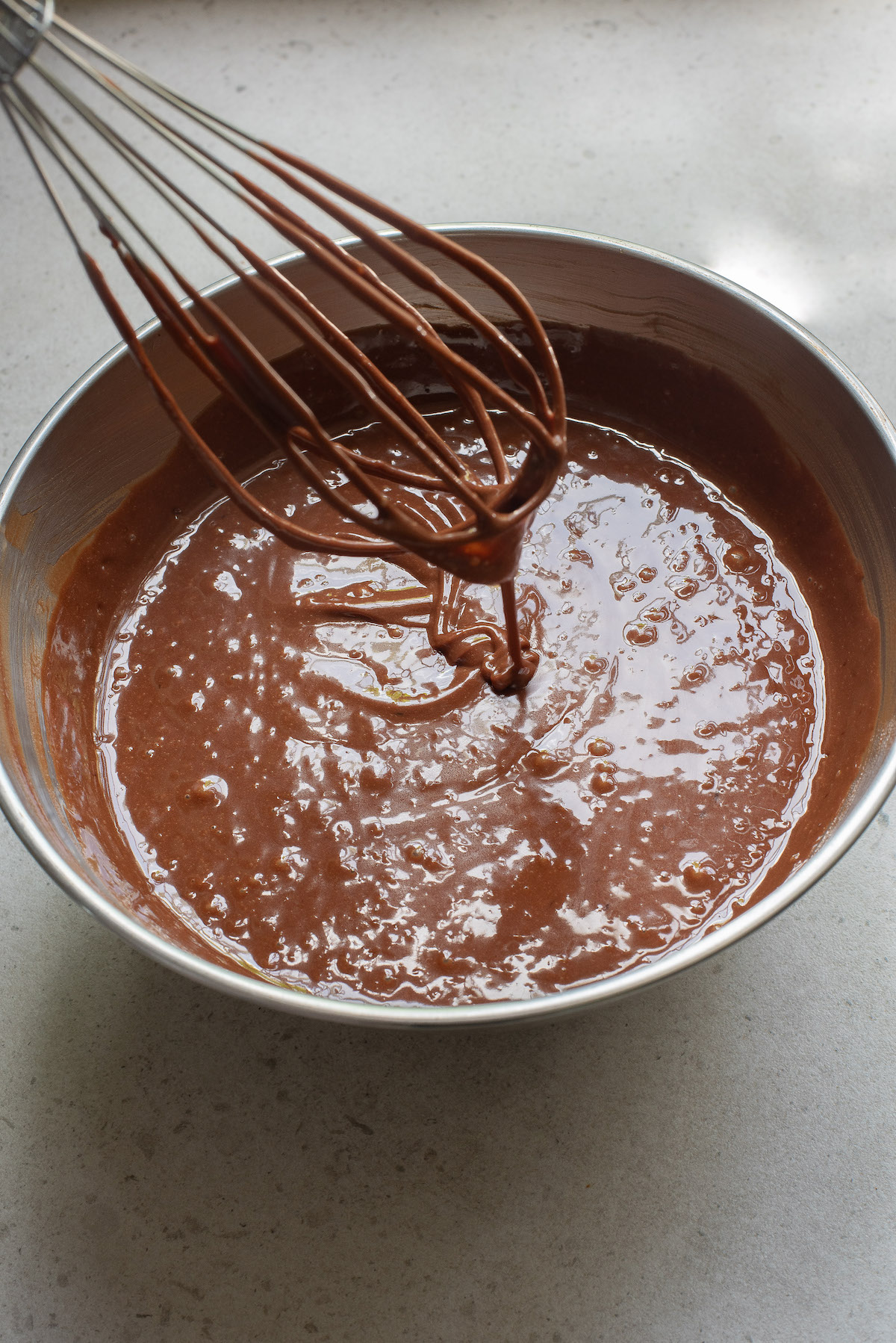 a whisk combining the pie filling ingredients in a large bowl
