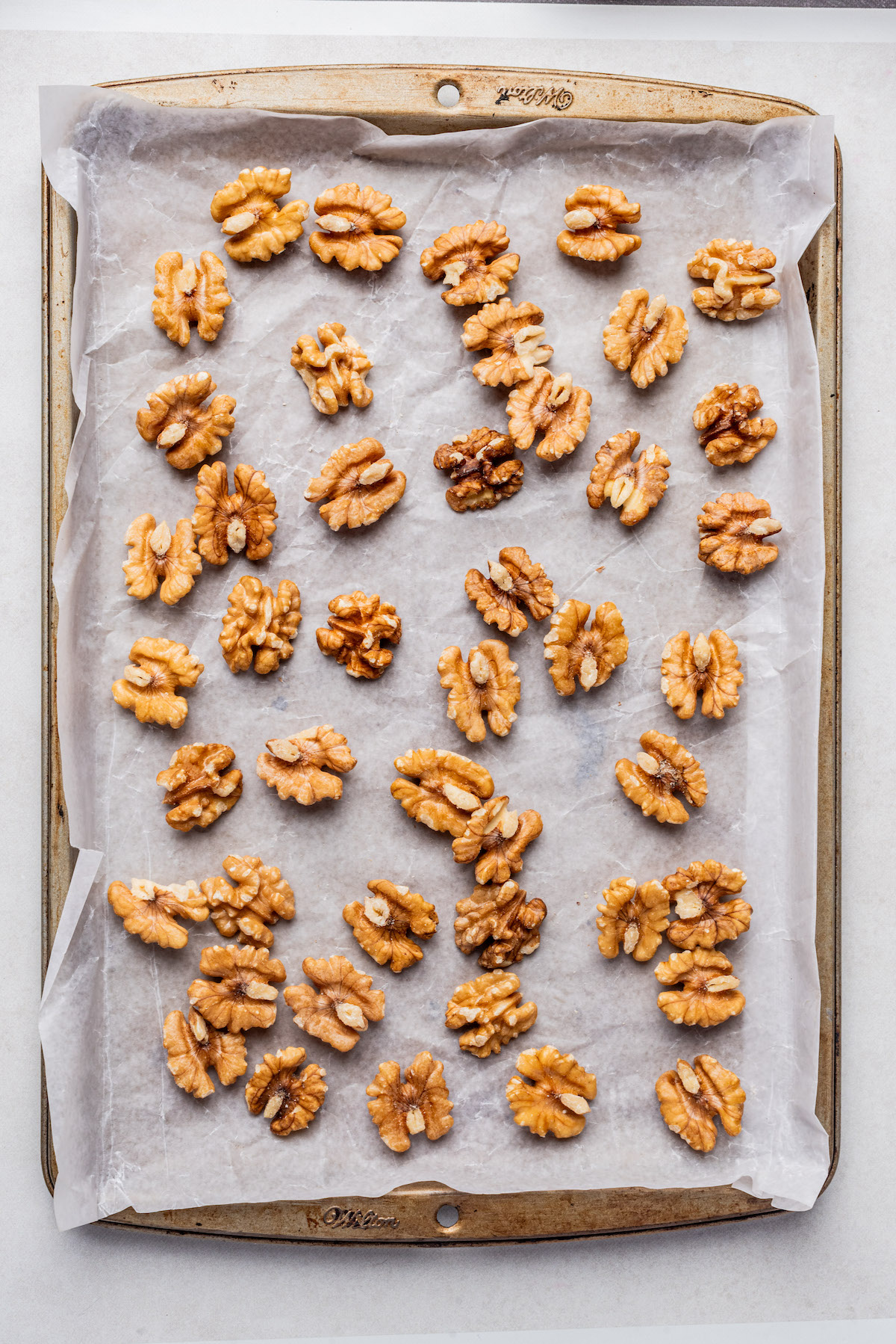 top down view of walnuts on a baking sheet