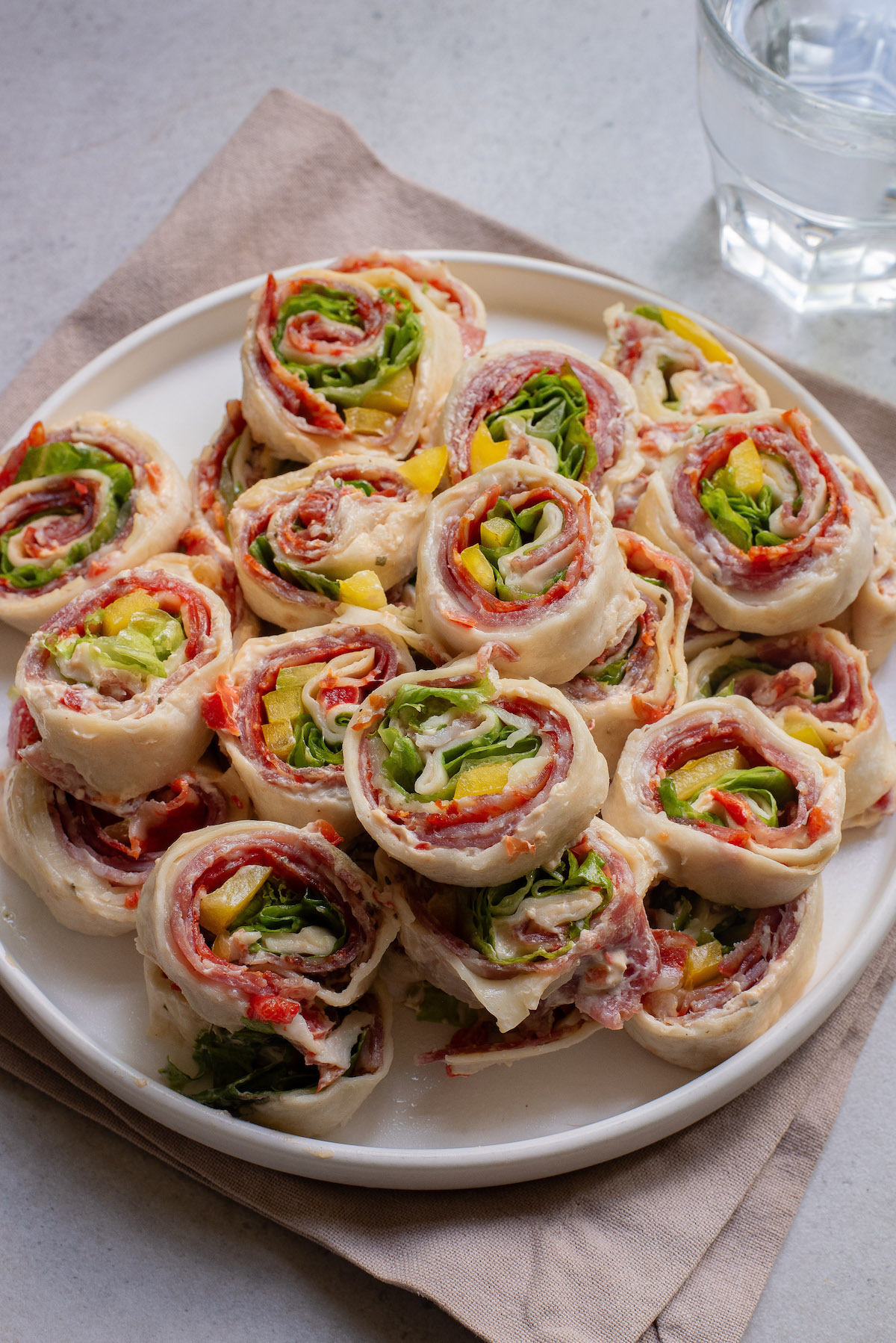 a platter filled with the completed pinwheel sandwiches