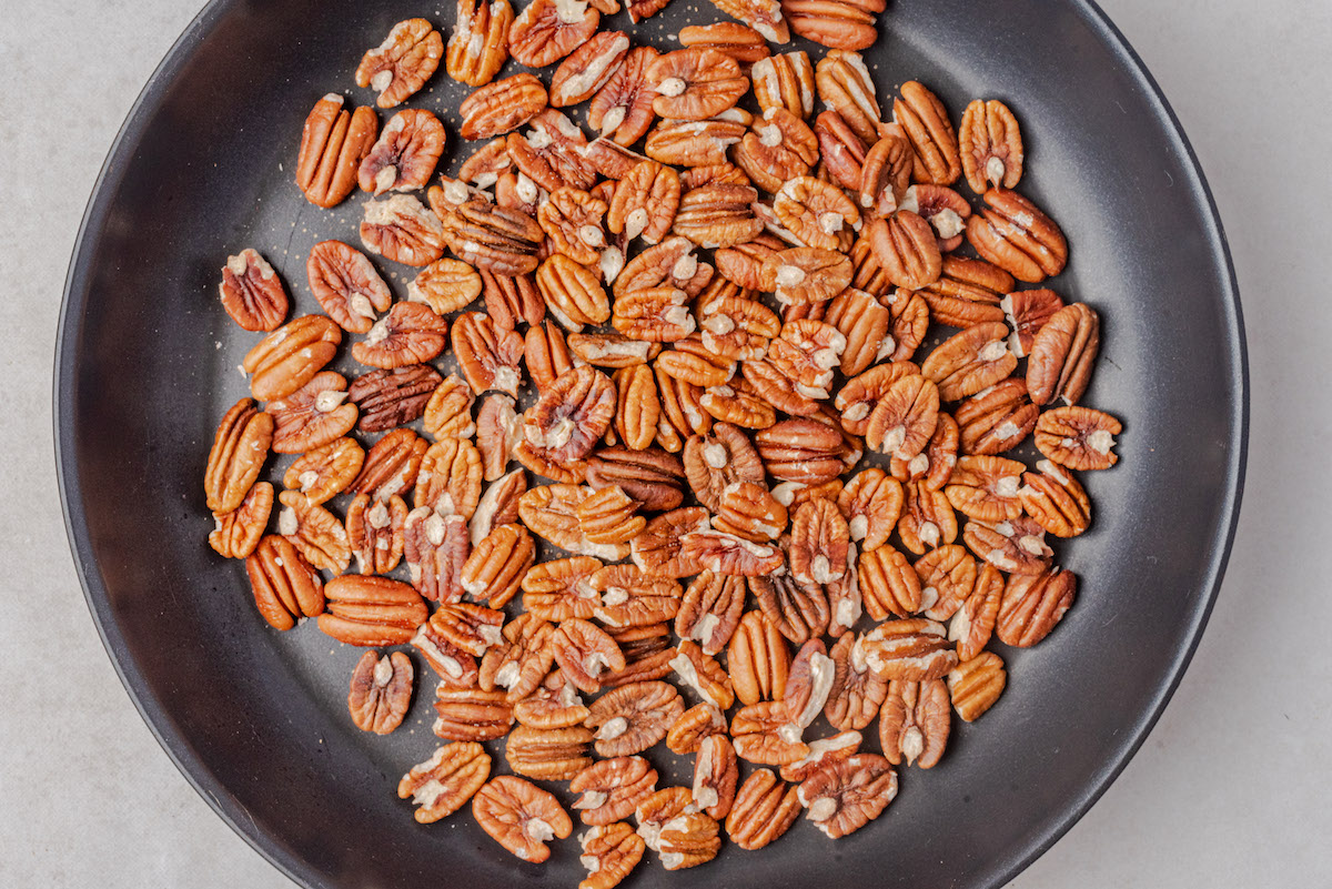 close up view of the finished toasted pecans in a skillet