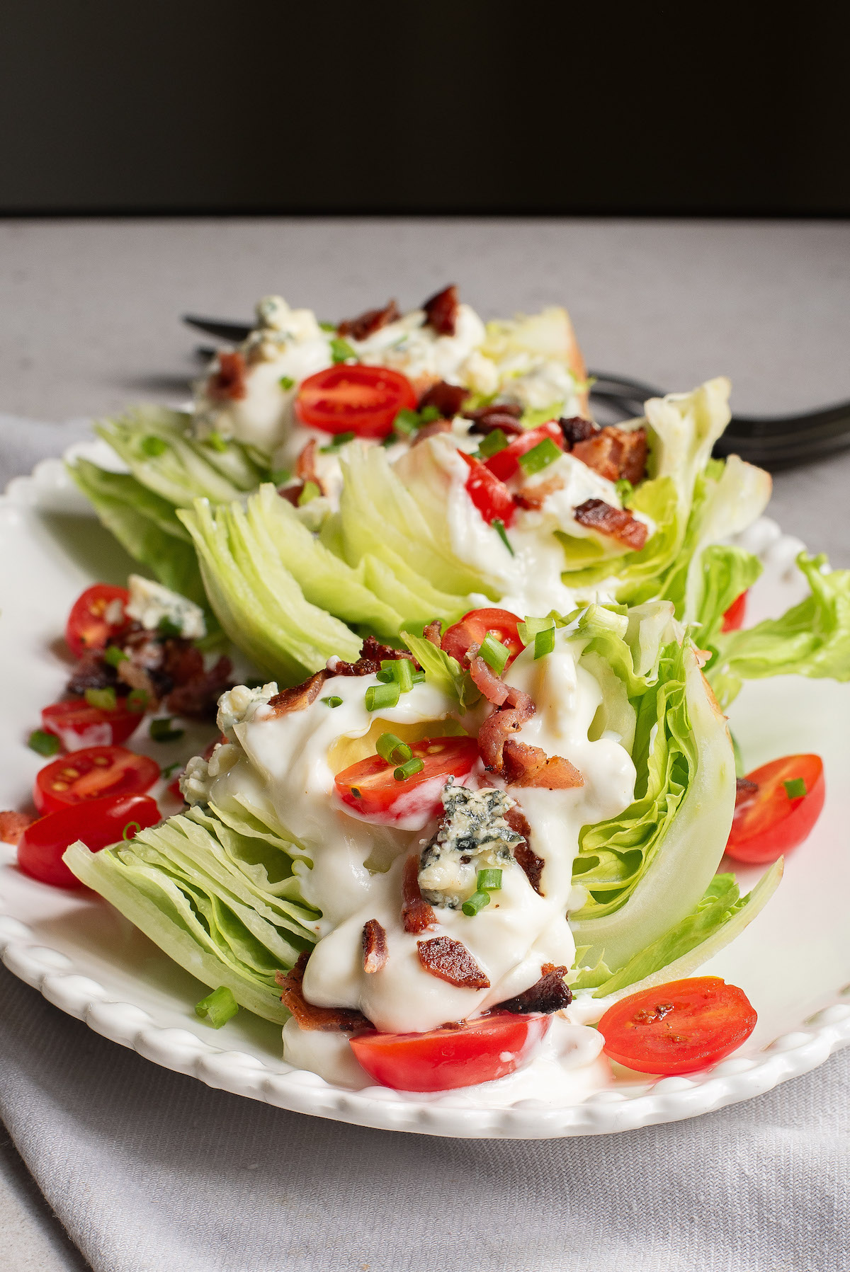 side view of the completed blue cheese and bacon wedge salad