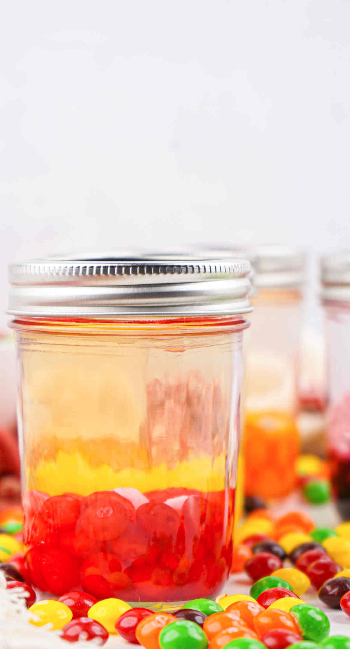 three filled jars with lids on