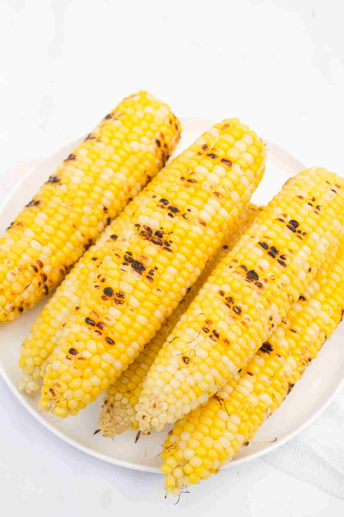 the finished corn on a white plate and ready to serve.