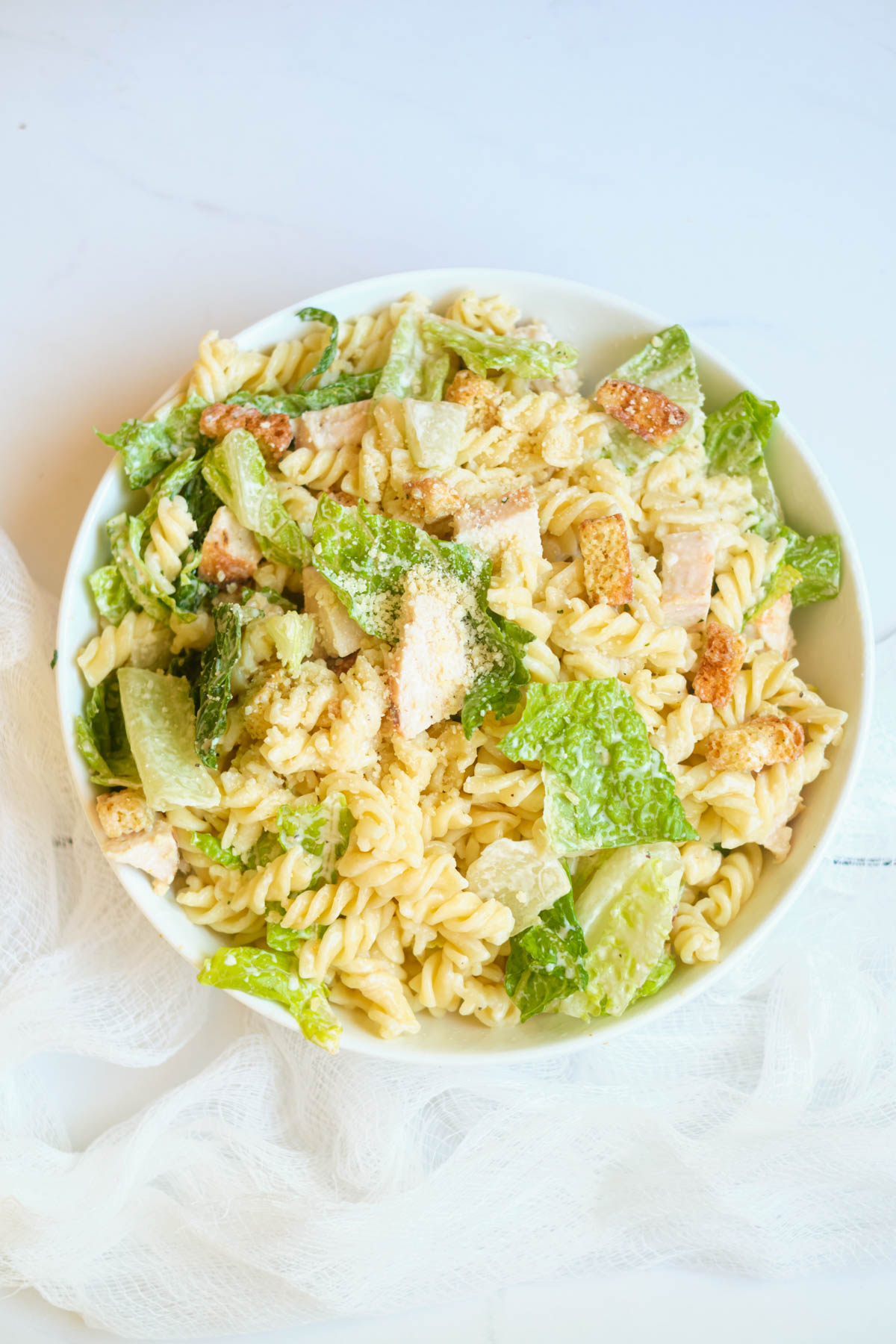 top down view of the completed chicken caesar pasta salad recipe.