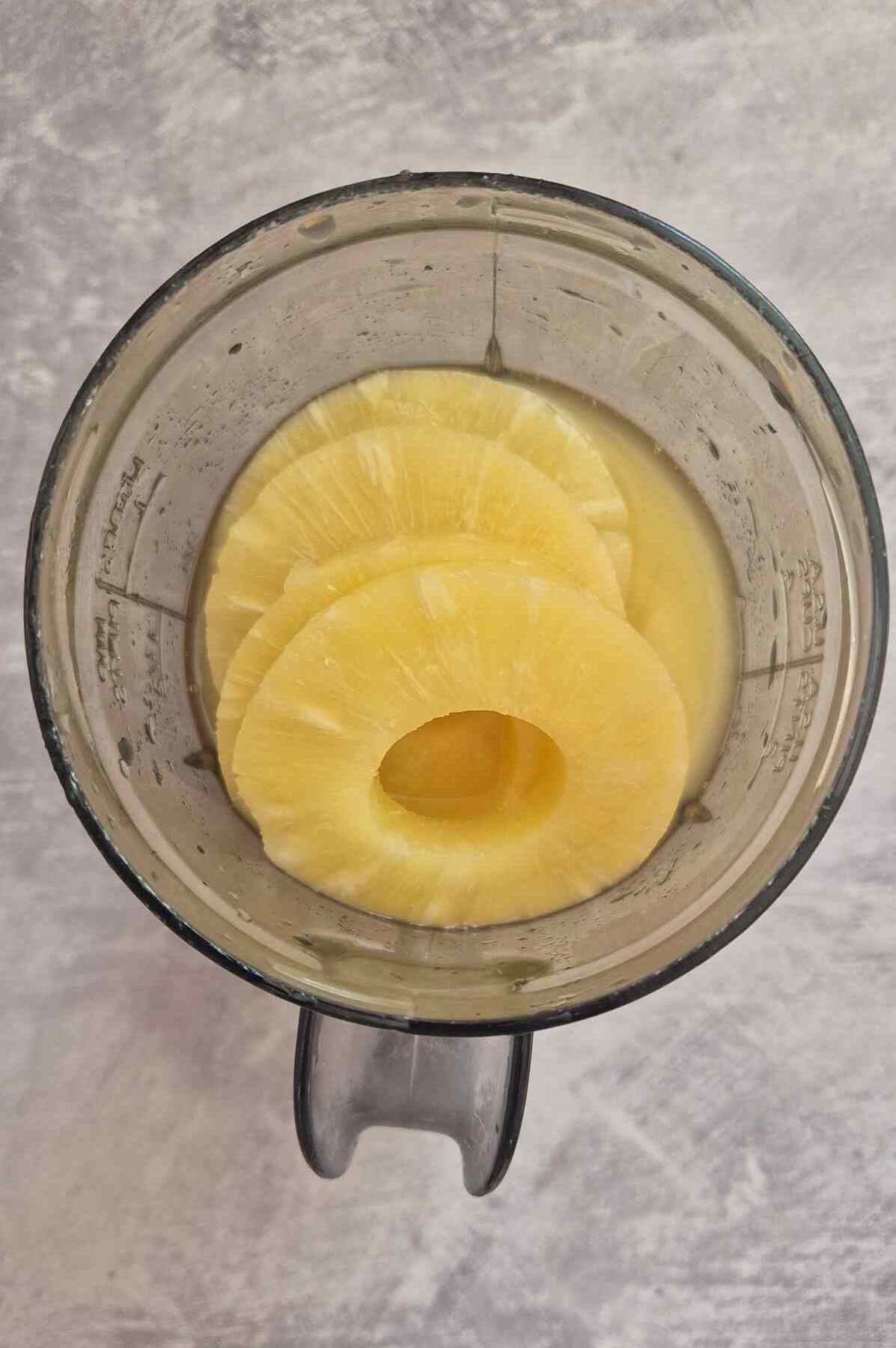 pineapple rings and lemon juice in a blender.