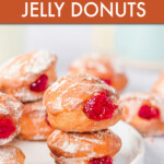 A stack of jelly donuts on a plate