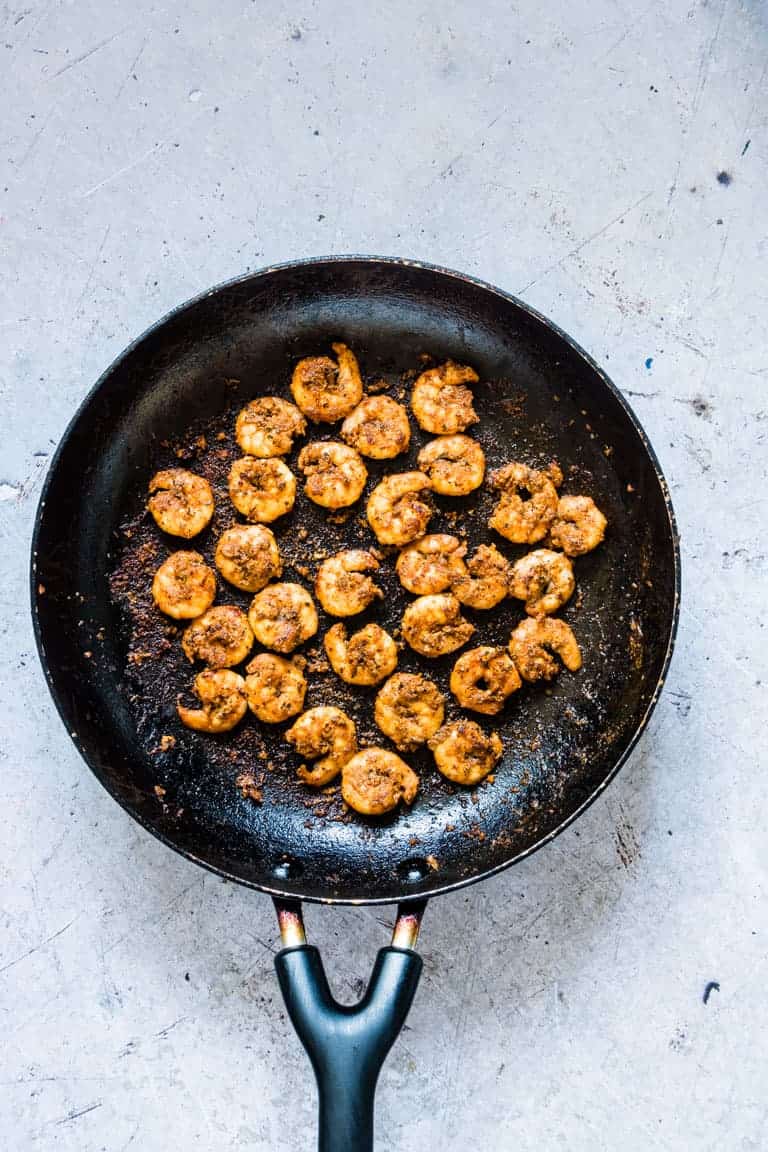 Shrimp being cooked in a skillet for this Cajun Shrimp Recipe