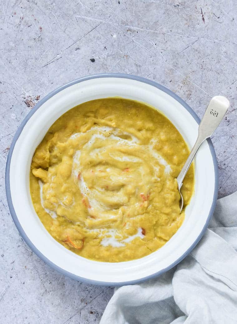 instant pot dal served in bowl with a silver spoon