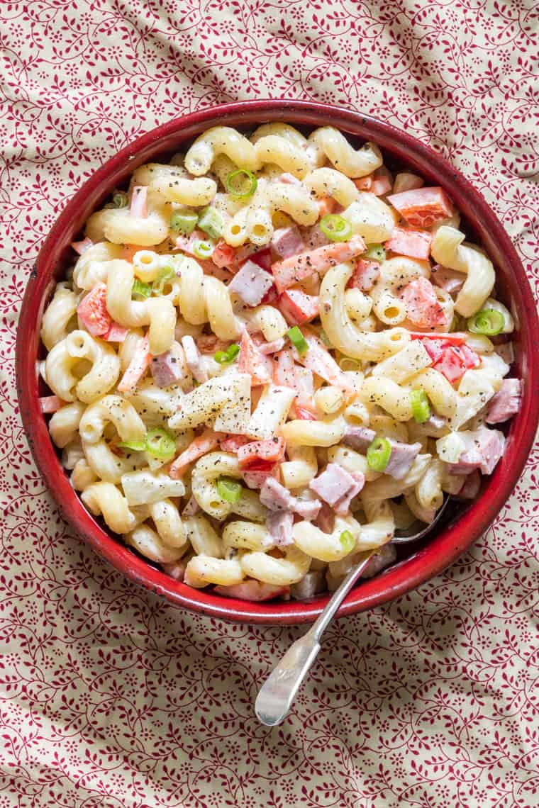 Hawaiian Pasta Salad served in a red bowl with spoon