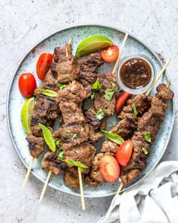 grilled lamb kabobs served with salad