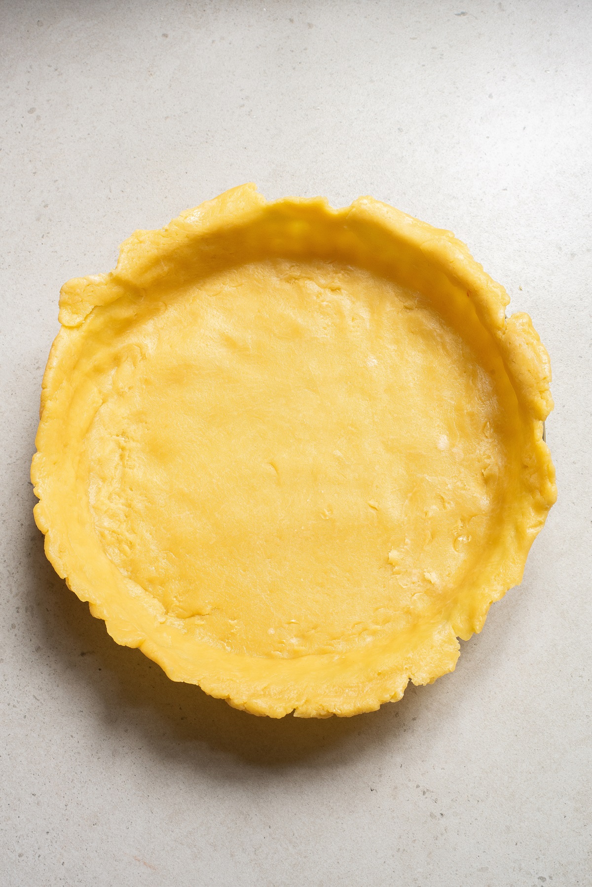 A pie crust shaped into a pie dish.