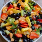 Easter fruit salad in a white bowl.