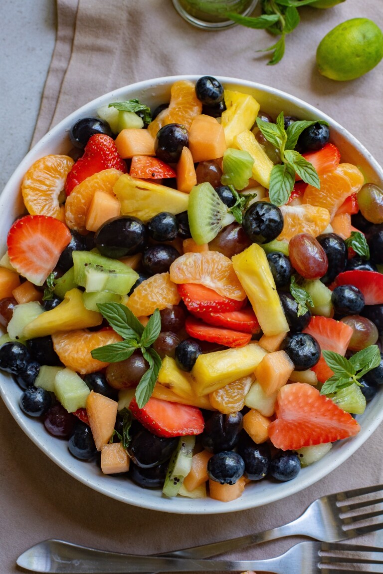 Easter fruit salad in a white bowl.