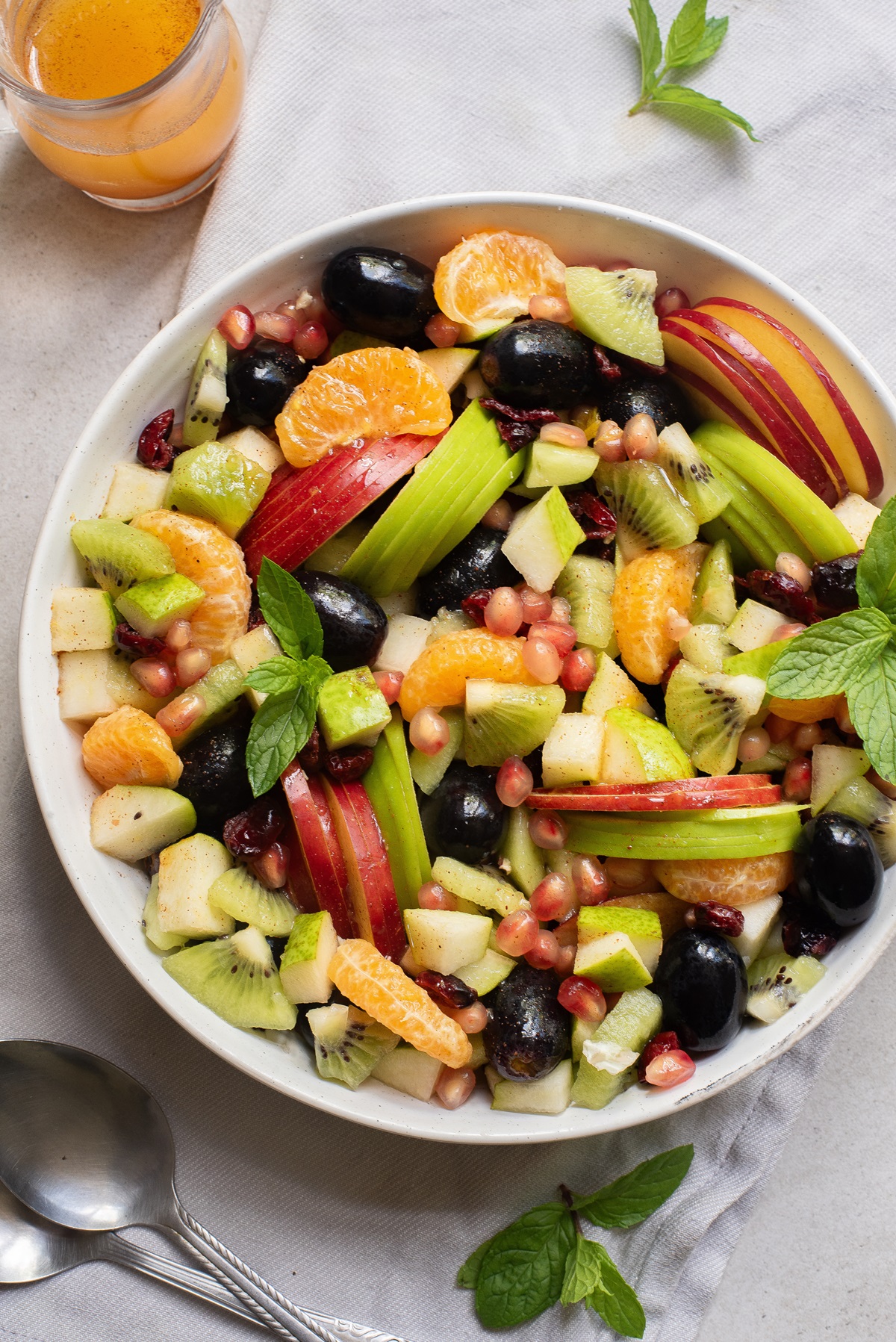 Round bowl with fruit in it.