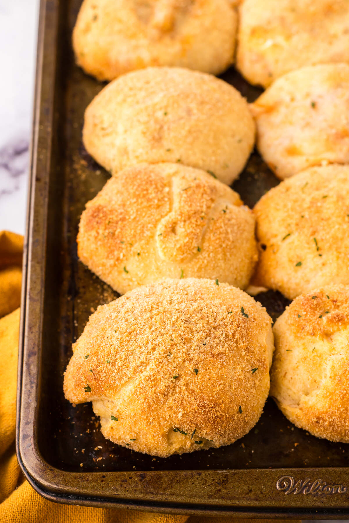 Close-up of crispy, golden-brown stuffed pockets fresh out of the oven.