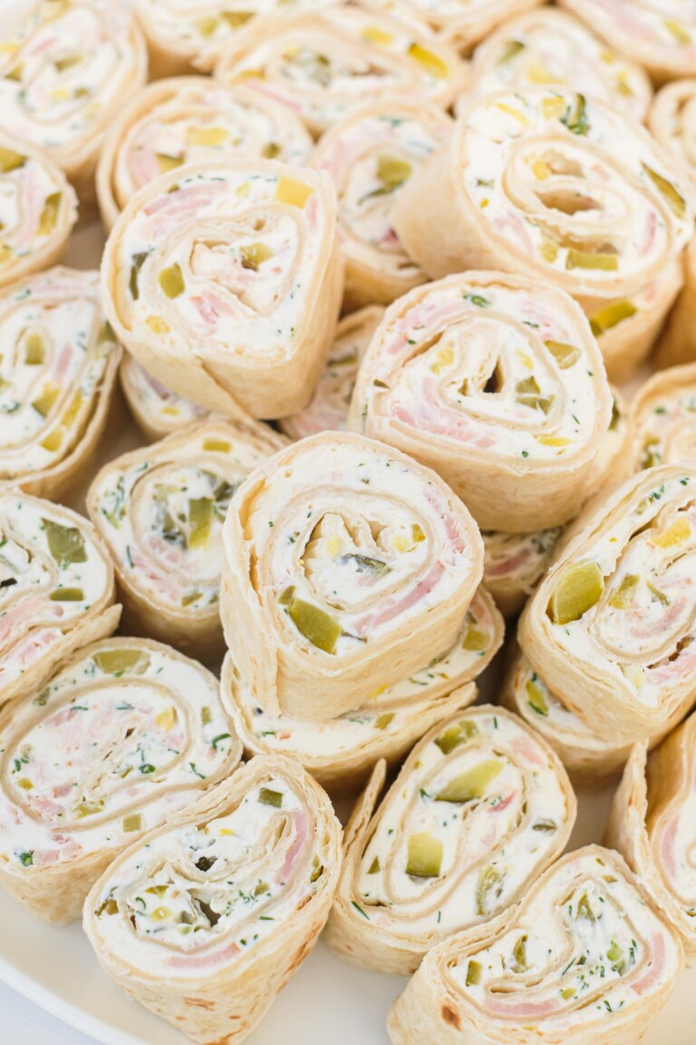 Pinwheels stacked on a serving platter.