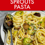 Close up image of Brussels sprouts pasta on a plate with silverware on the side