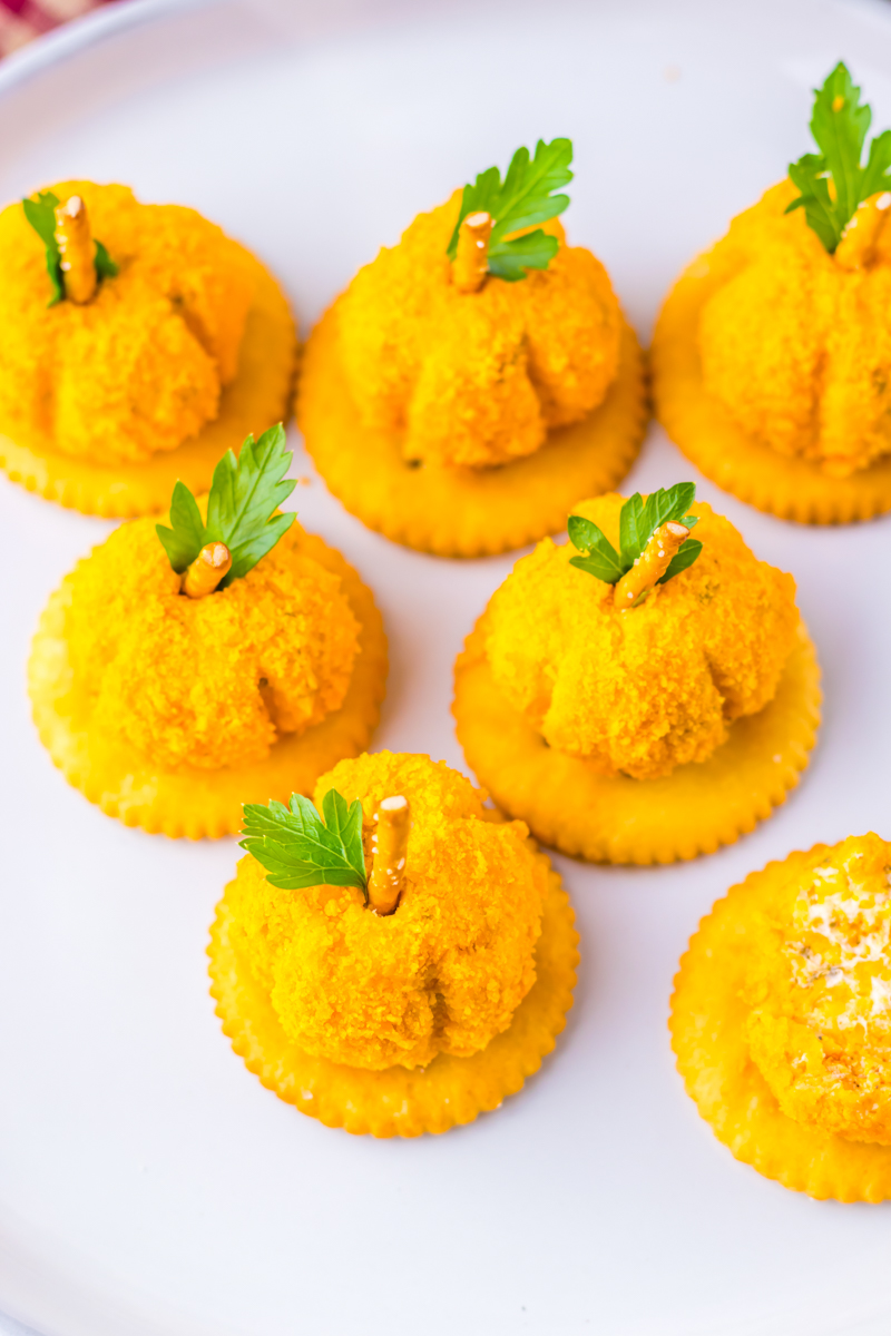 Cheeseballs on a white surface.