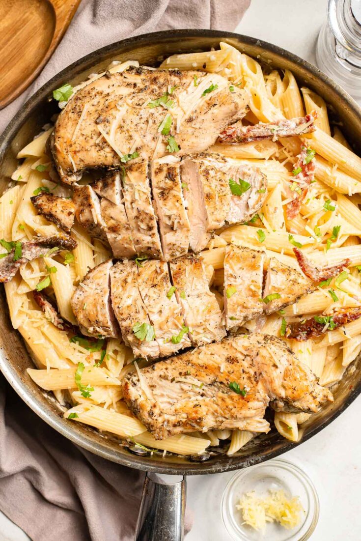 Garlic parmesan chicken pasta in a skillet.