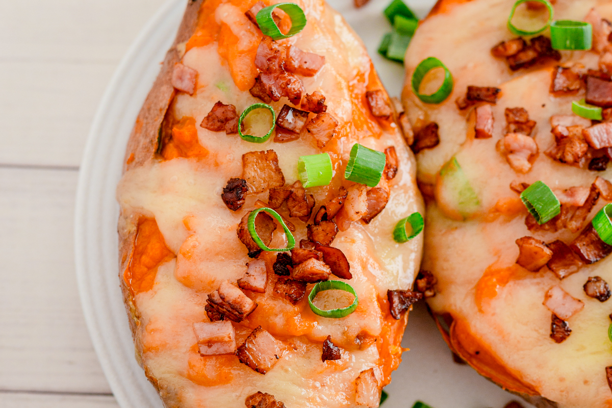 Twice baked sweet potatoes on a white plate.